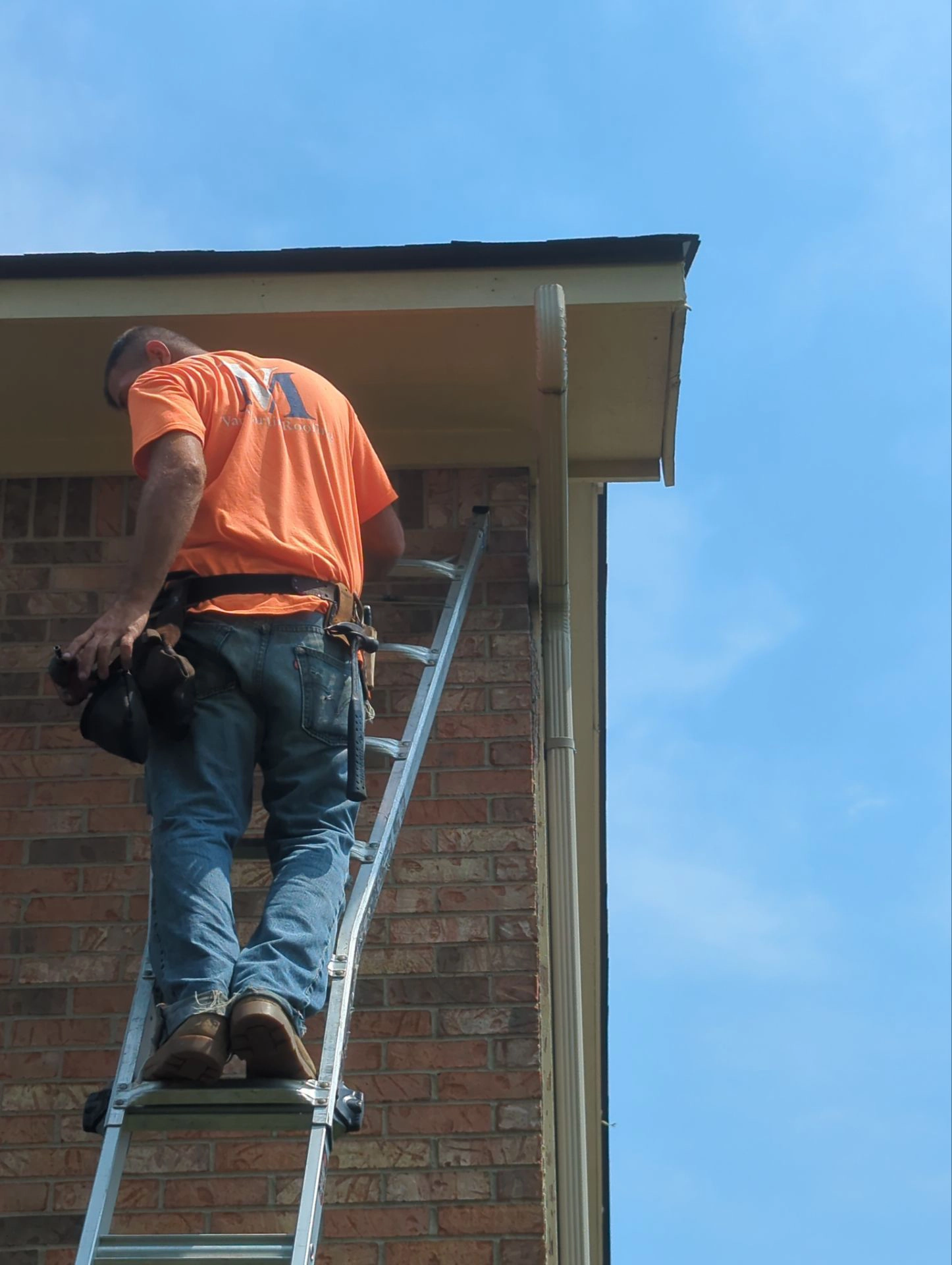 Van martin expert inspecting gutter
